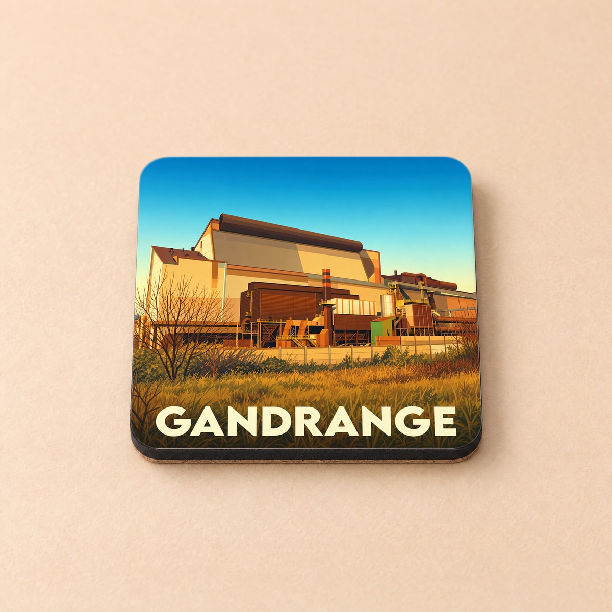 Dessous de verre souvenir de la ville de Gandrange arborant une illustration stylisée de son patrimoine industriel.