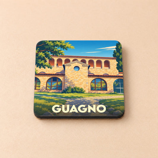 Dessous de verre souvenir de la ville de Guagno avec une illustration stylisée d'un bâtiment en pierre.