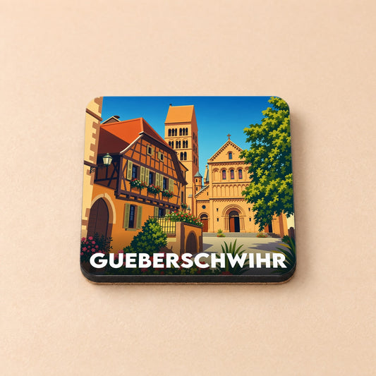 Dessous de verre souvenir de la ville de Gueberschwihr avec une illustration stylisée de son architecture traditionnelle.
