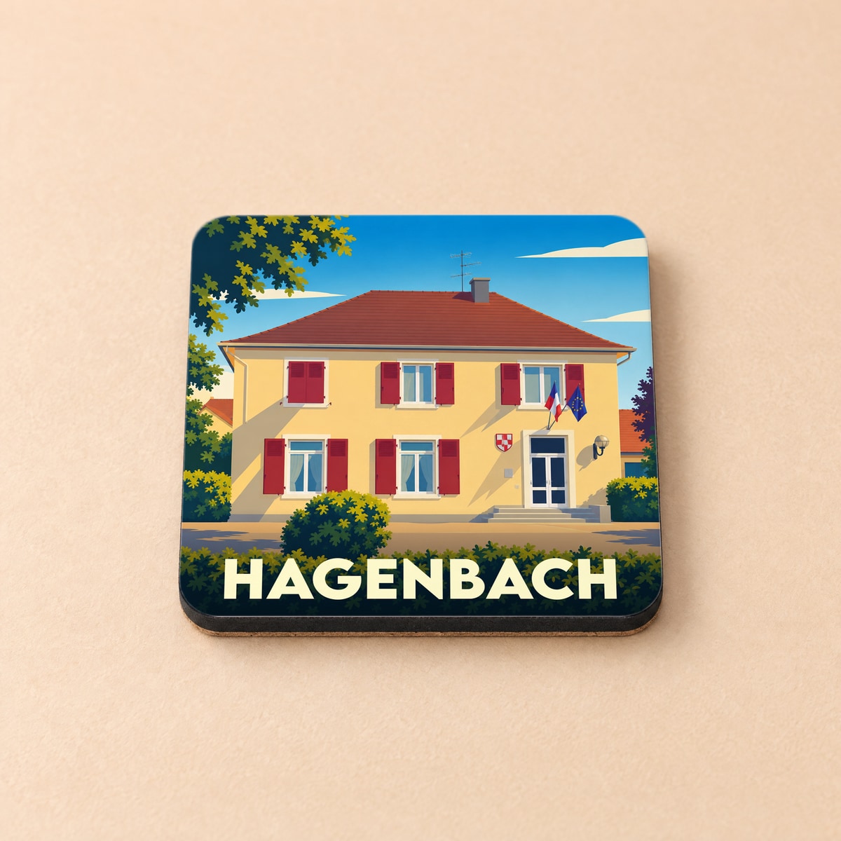 Dessous de verre souvenir de la ville de Hagenbach avec une illustration stylisée de sa mairie.