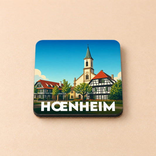 Dessous de verre souvenir de la ville de Hœnheim avec une illustration stylisée de son architecture traditionnelle.