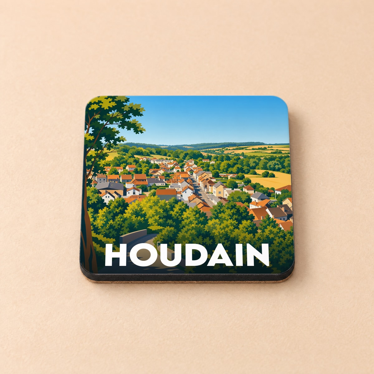 Dessous de verre souvenir de la ville de Houdain avec une illustration stylisée d'un paysage urbain verdoyant.