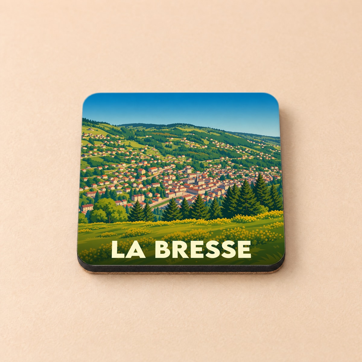 Dessous de verre souvenir de la ville de La Bresse avec une illustration stylisée de ses paysages montagneux.