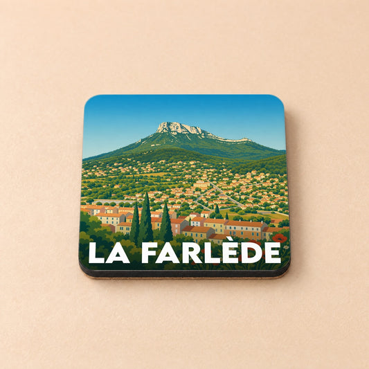 Dessous de verre souvenir de la ville de La Farlède avec une illustration stylisée d'un paysage provençal.