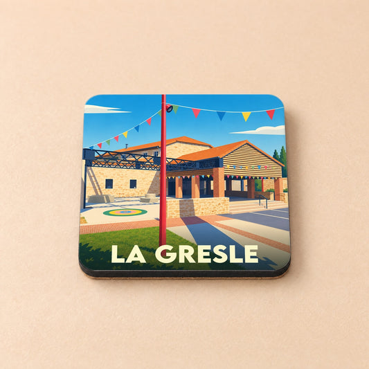 Dessous de verre souvenir de la ville de La Gresle avec une illustration stylisée et colorée.