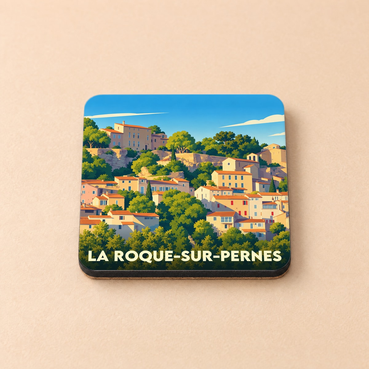 Dessous de verre souvenir de la ville de La Roque-sur-Pernes avec une illustration stylisée.