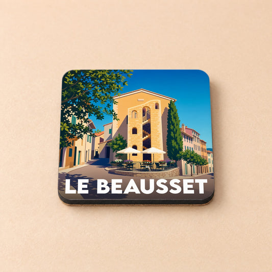 Dessous de verre souvenir de la ville de Le Beausset avec une illustration stylisée d'une place ensoleillée.