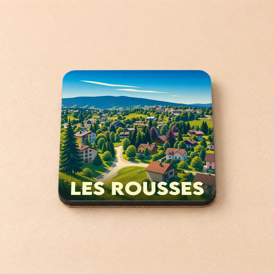 Dessous de verre souvenir de la ville de Les Rousses avec une illustration stylisée d'un village de montagne.