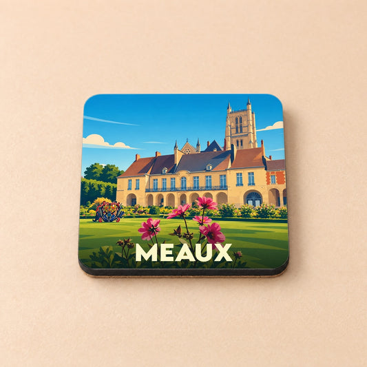 Dessous de verre souvenir de la ville de Meaux avec une illustration stylisée du Palais épiscopal et de la cathédrale.