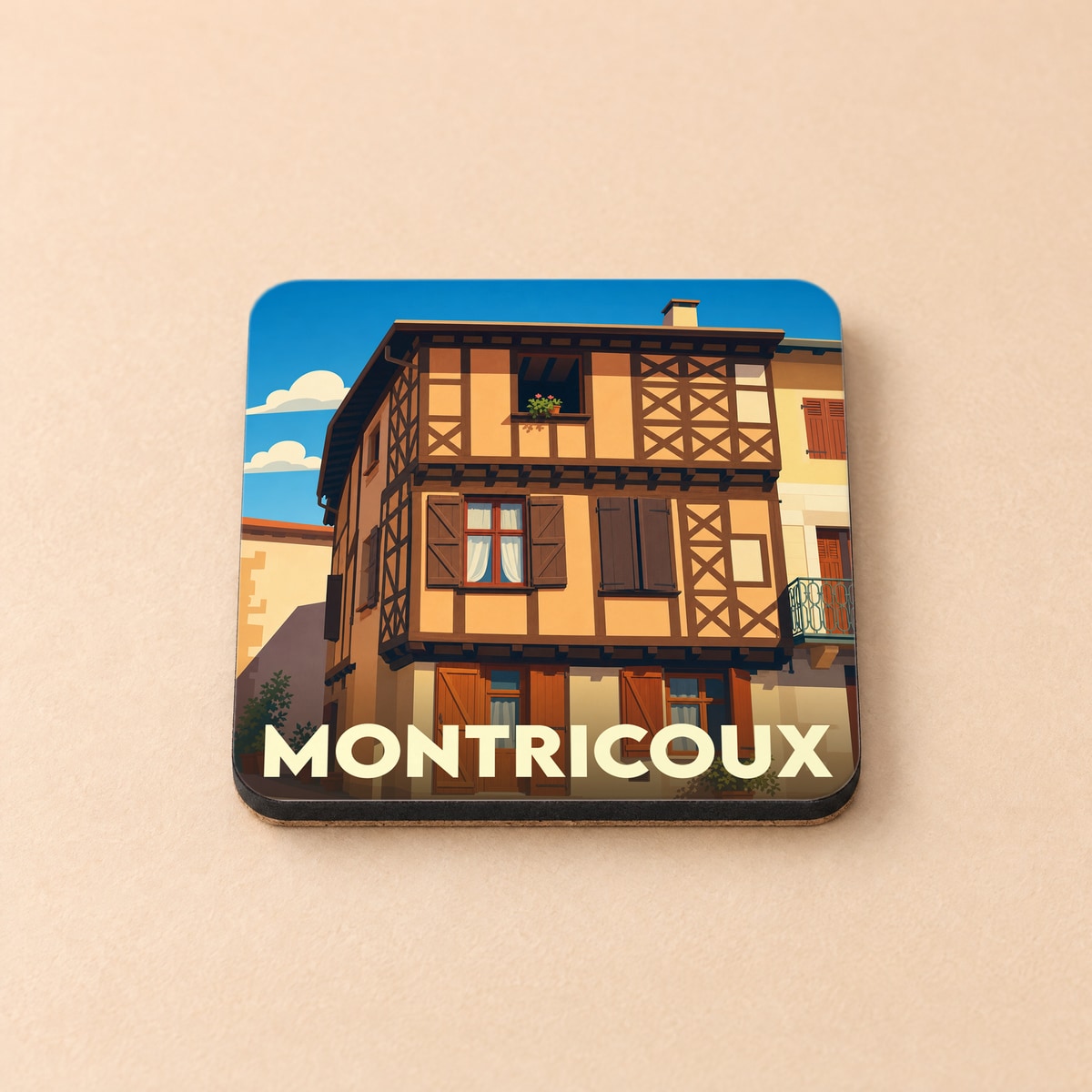 Dessous de verre souvenir de la ville de Montricoux avec une illustration stylisée d'une maison à colombages.