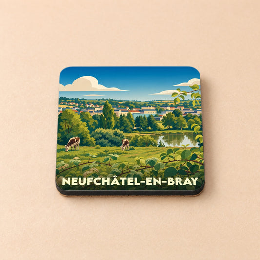 Dessous de verre souvenir de la ville de Neufchâtel-en-Bray avec une illustration paysagère stylisée.