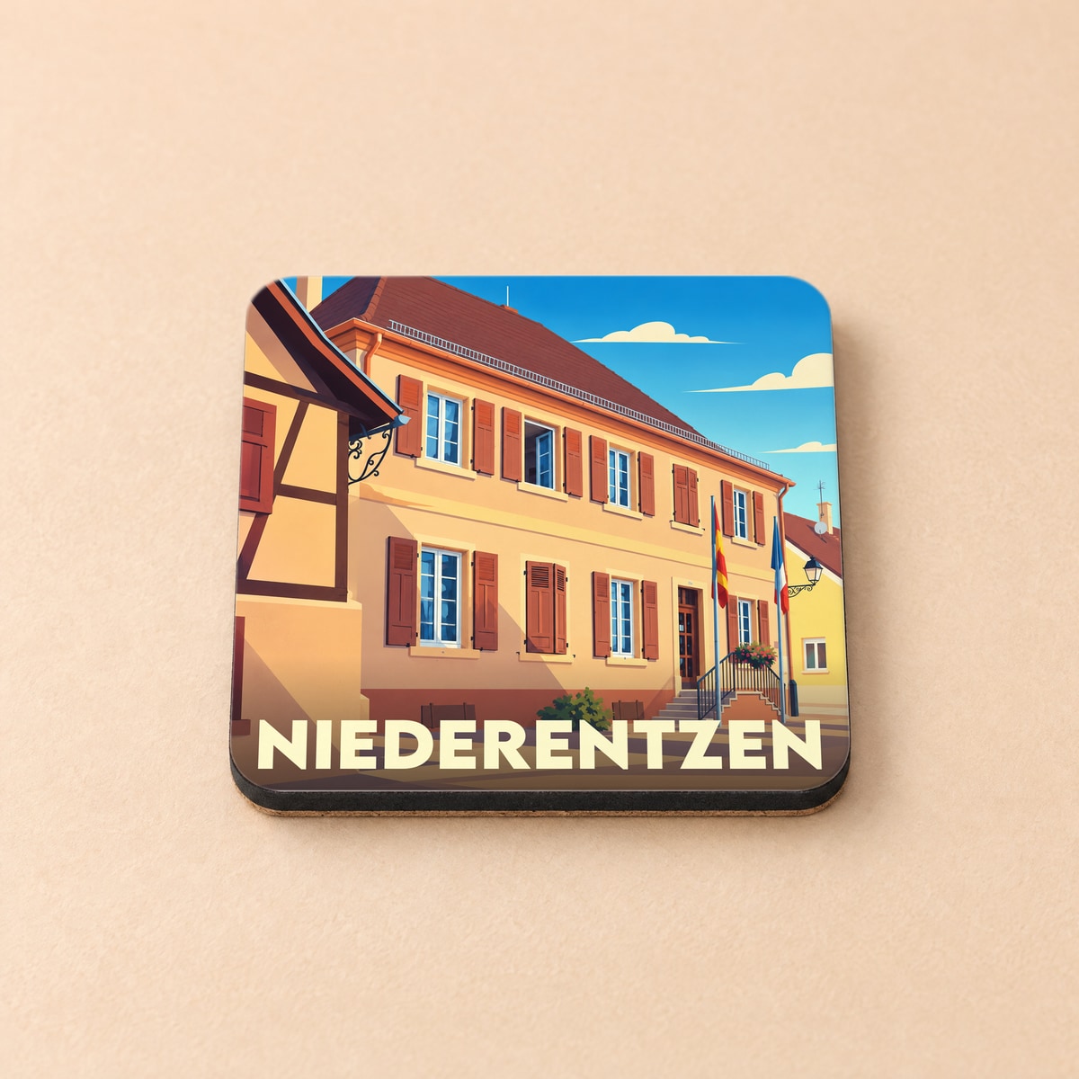 Dessous de verre souvenir de la ville de Niederentzen avec une illustration stylisée de bâtiments locaux.
