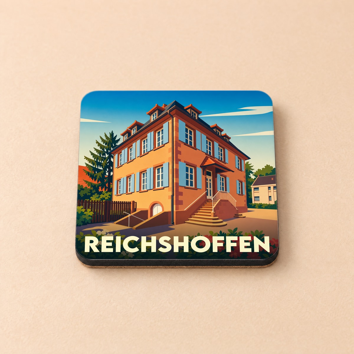 Dessous de verre souvenir de la ville de Reichshoffen avec une illustration stylisée d'un bâtiment traditionnel alsacien.