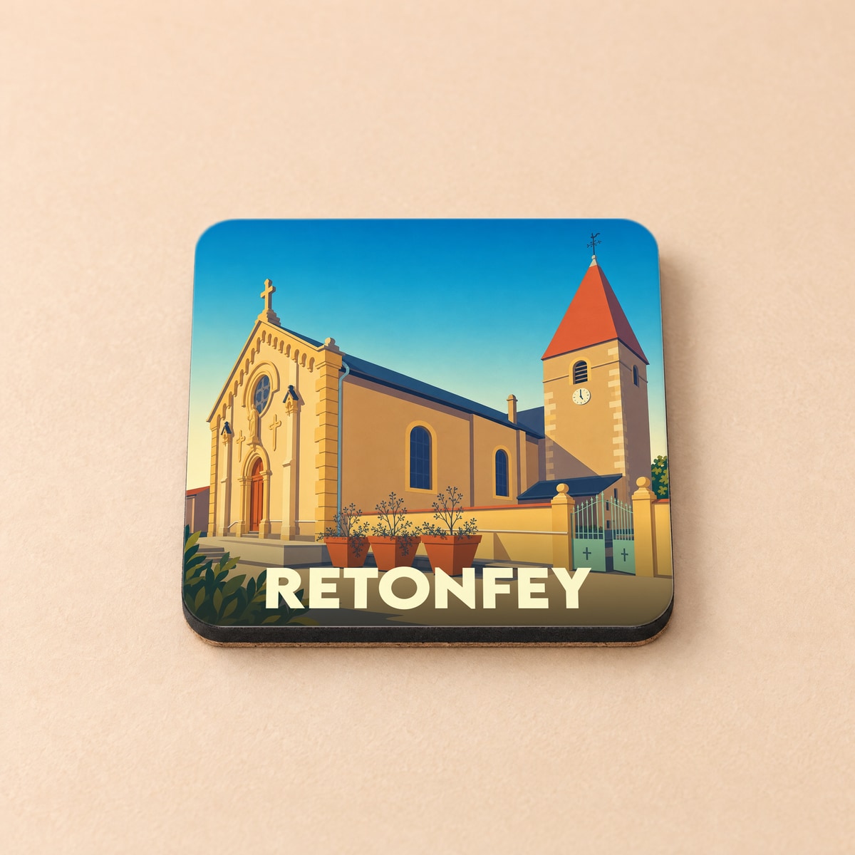 Dessous de verre souvenir de la ville de Retonfey avec une illustration stylisée d'une église.
