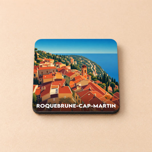 Dessous de verre souvenir de la ville de Roquebrune-Cap-Martin avec une illustration stylisée de son village perché en bord de mer.