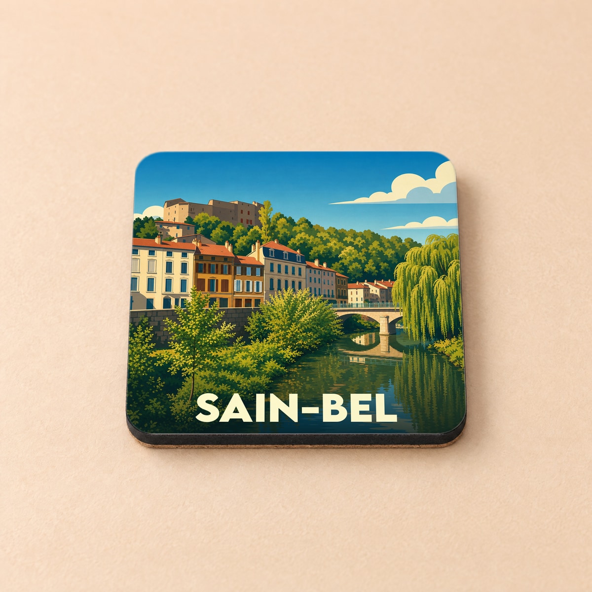 Dessous de verre souvenir de la ville de Sain-Bel avec une illustration stylisée.