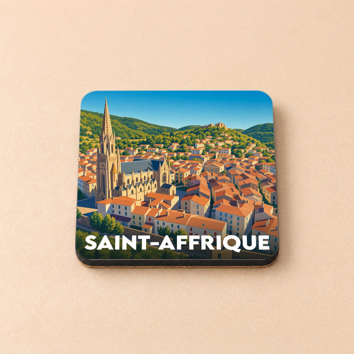 Dessous de verre souvenir de la ville de Saint-Affrique avec une illustration stylisée.
