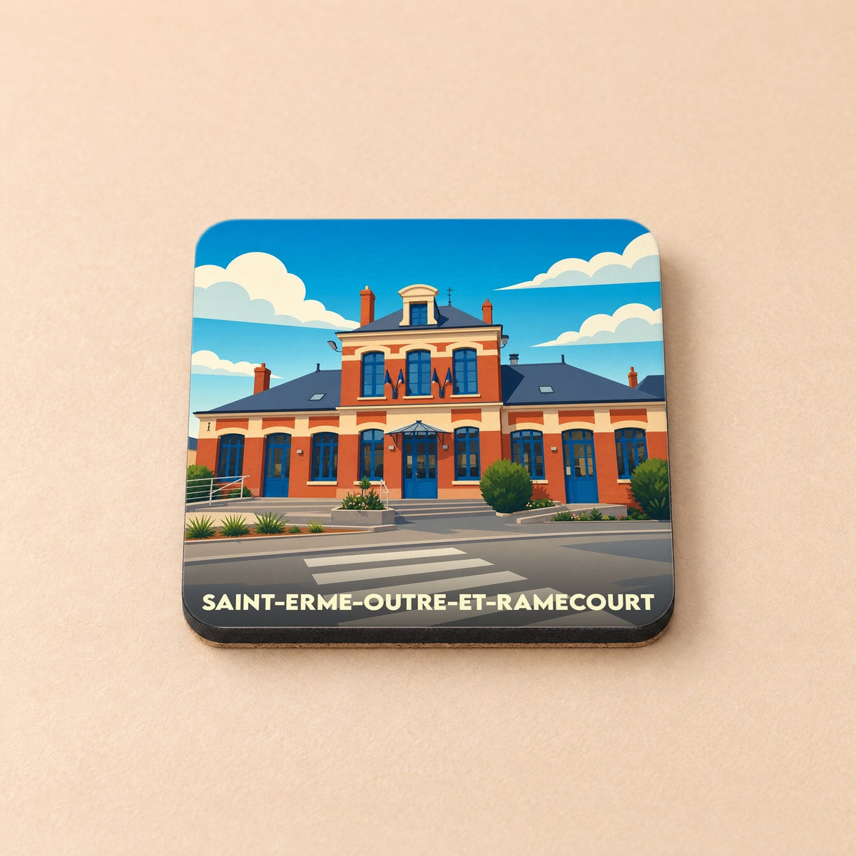 Dessous de verre souvenir de la ville de Saint-Erme-Outre-et-Ramecourt avec une illustration stylisée de sa gare.