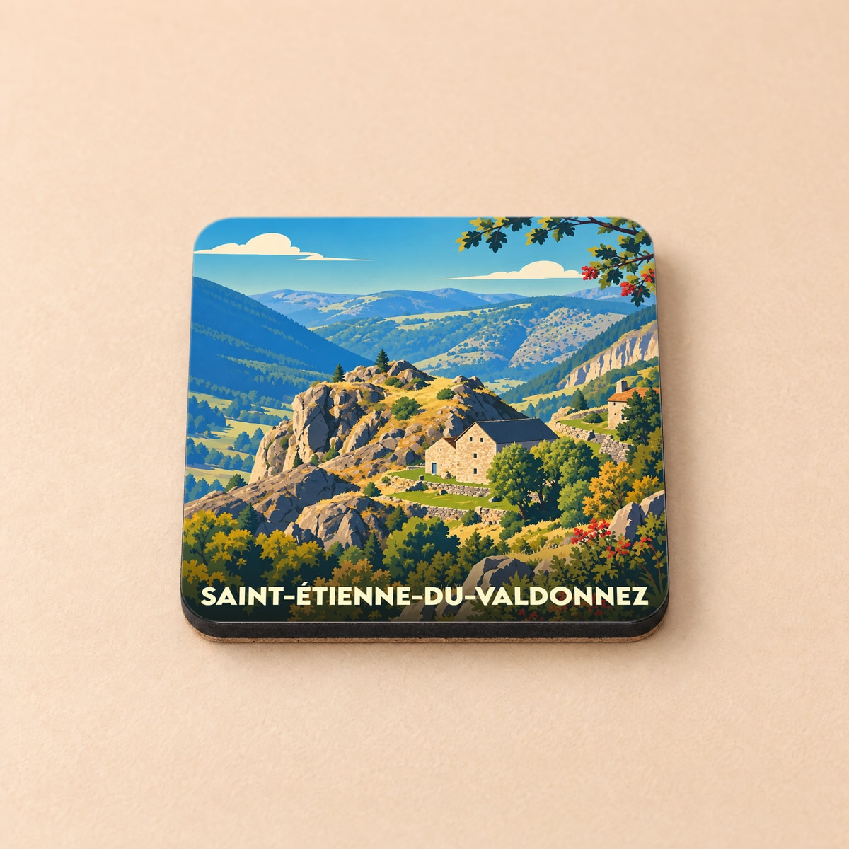 Dessous de verre souvenir de Saint-Étienne-du-Valdonnez illustré d'un paysage montagneux stylisé.