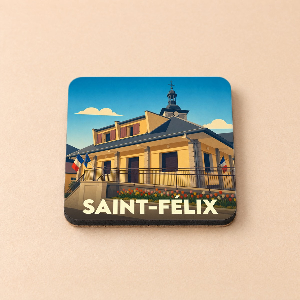 Dessous de verre souvenir de la ville de Saint-Félix avec une illustration stylisée de sa mairie.