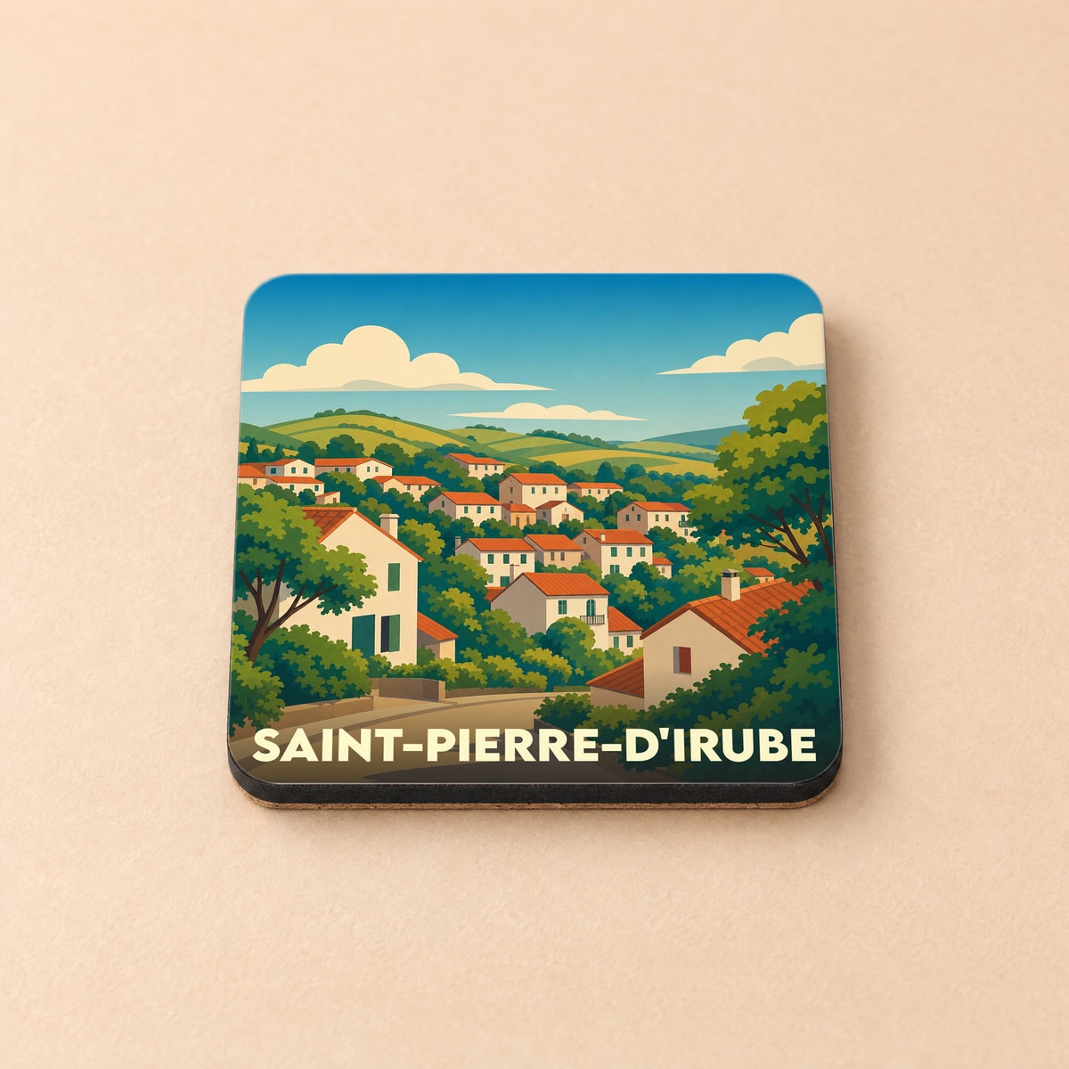 Dessous de verre souvenir de la ville de Saint-Pierre-d'Irube avec une illustration stylisée de son paysage vallonné.