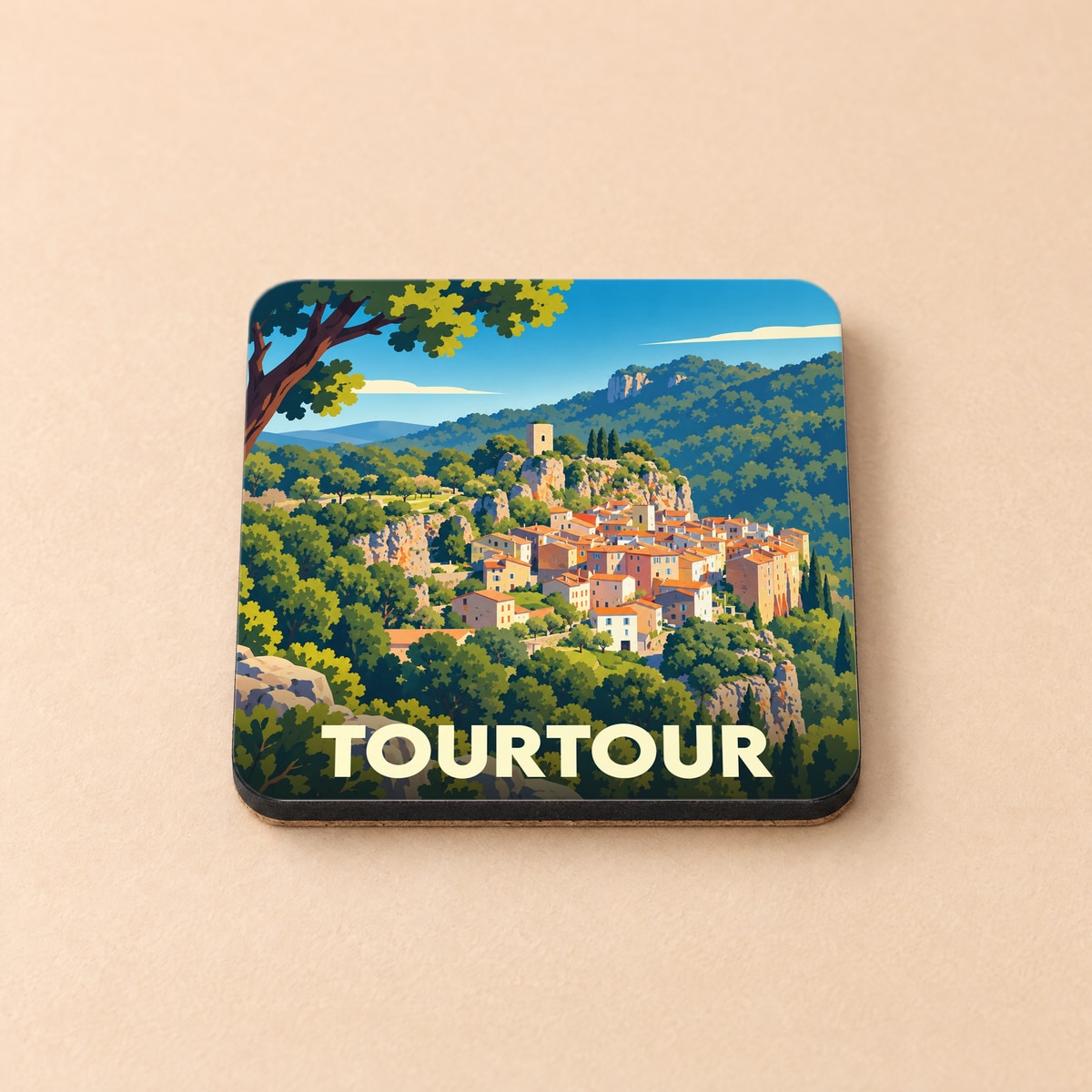 Dessous de verre souvenir de la ville de Tourtour avec une illustration stylisée d'un village perché.