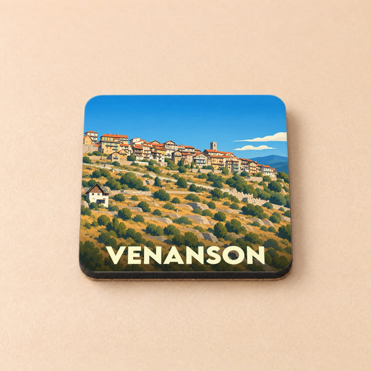 Dessous de verre souvenir de la ville de Venanson avec une illustration stylisée d'un village perché.