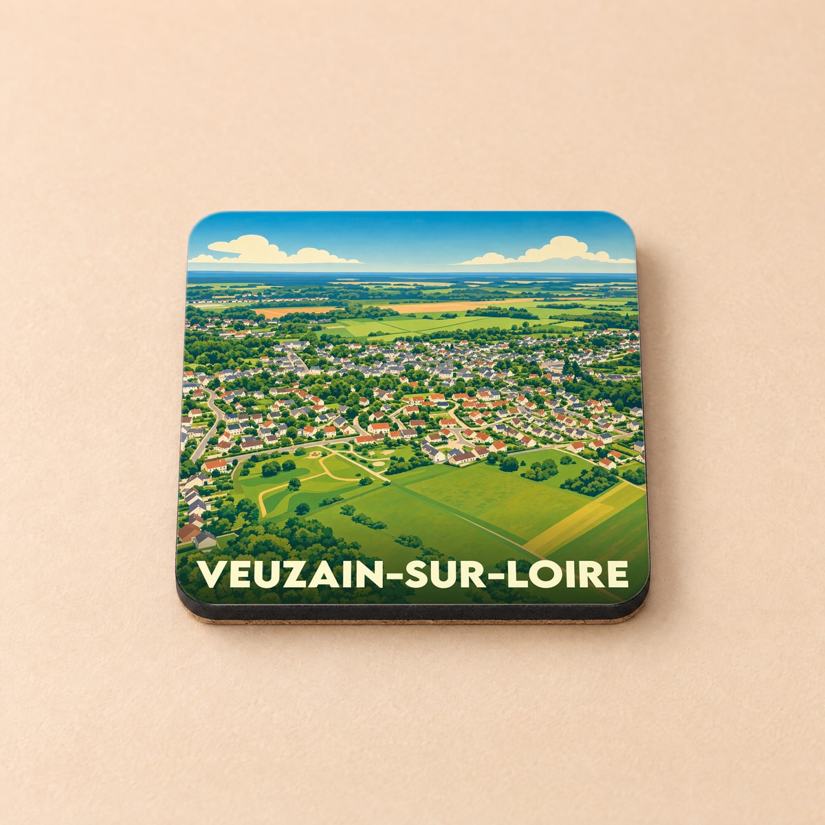 Dessous de verre souvenir de la ville de Veuzain-sur-Loire avec une illustration stylisée vue du ciel.