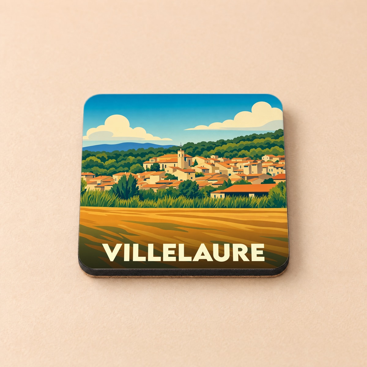 Dessous de verre souvenir de la ville de Villelaure avec une illustration stylisée d'un village provençal.