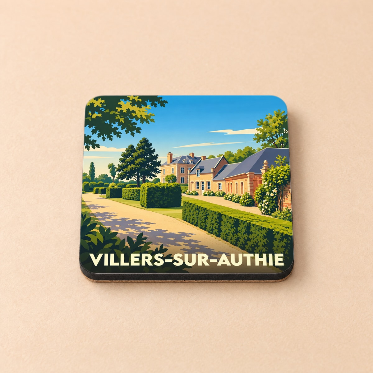 Dessous de verre souvenir de Villers-sur-Authie avec une illustration stylisée de maisons et jardins.