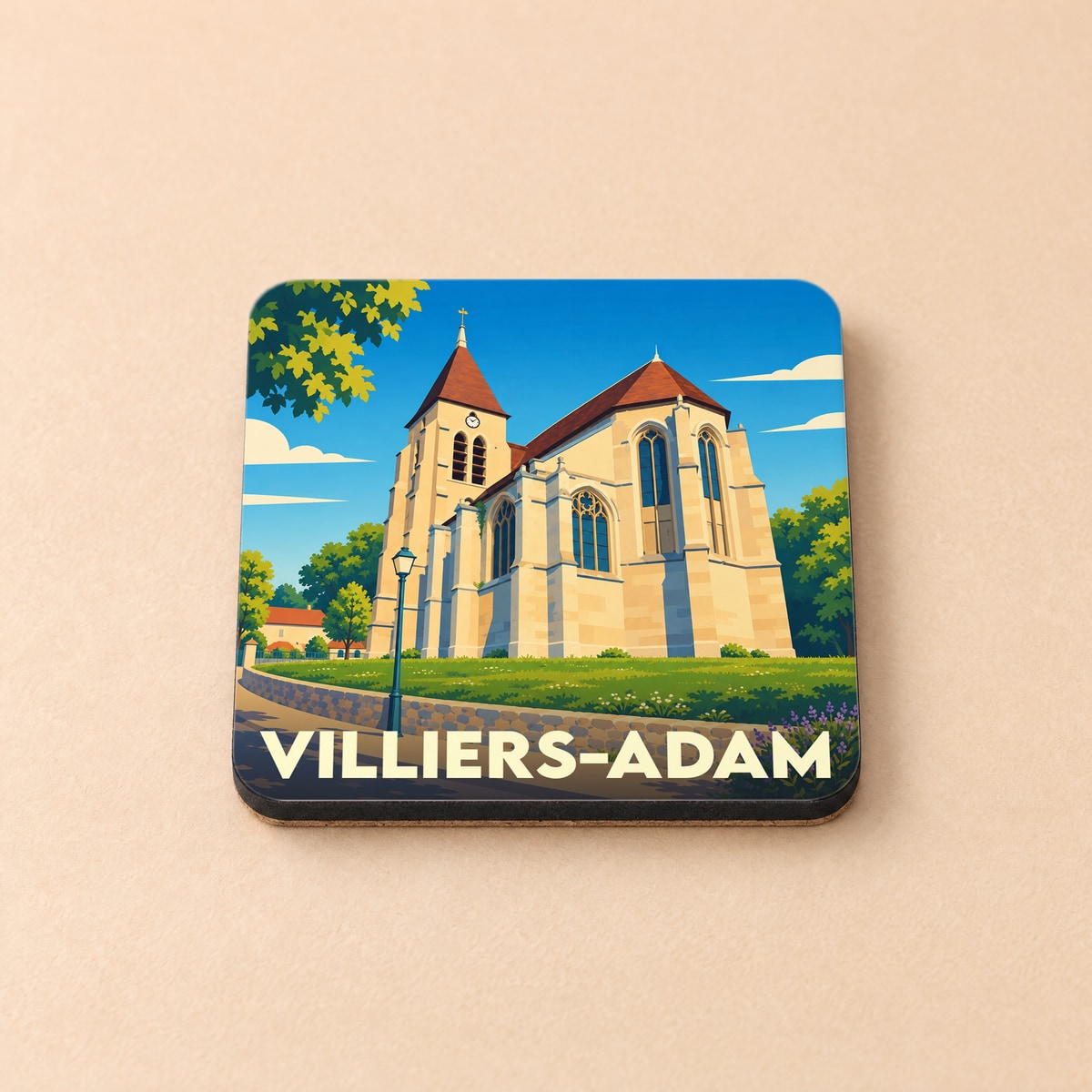 Dessous de verre souvenir de la ville de Villiers-Adam avec une illustration stylisée de son église.