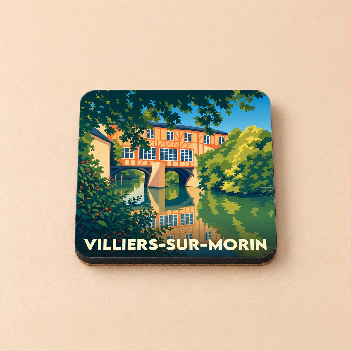 Dessous de verre souvenir de la ville de Villiers-sur-Morin avec une illustration stylisée d'un pont habité au bord de l'eau.