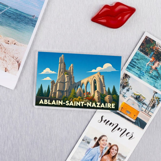 Magnet souvenir de la ville d'Ablain-Saint-Nazaire avec une illustration stylisée de son église ruinée.