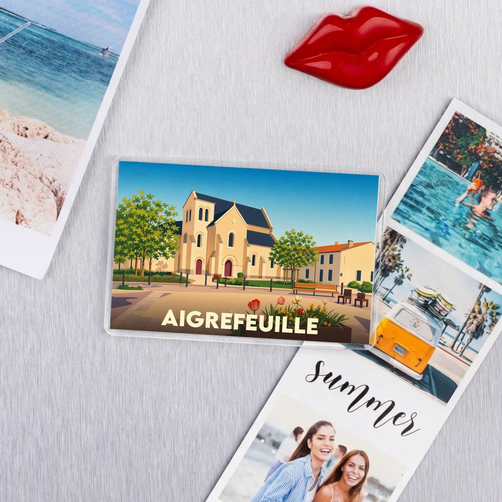 Magnet souvenir de la ville de Aigrefeuille avec une illustration stylisée d'une église.