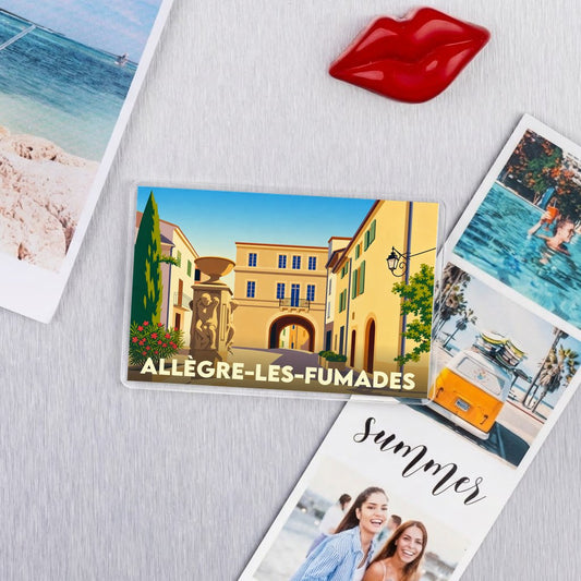 Magnet souvenir de la ville d'Allègre-les-Fumades avec une illustration stylisée.
