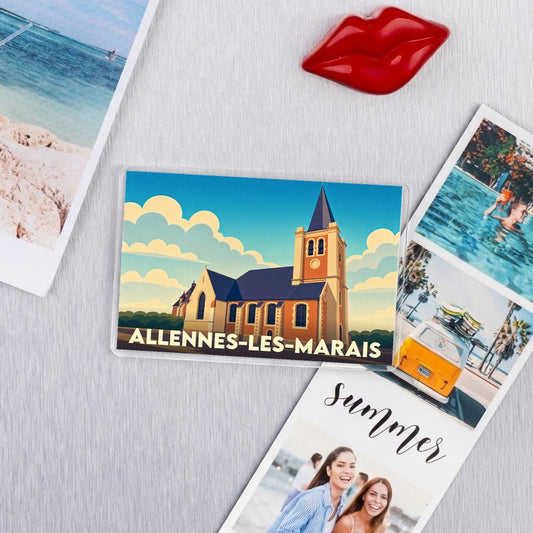 Magnet souvenir de la ville d'Allennes-les-Marais avec une illustration stylisée de son église.