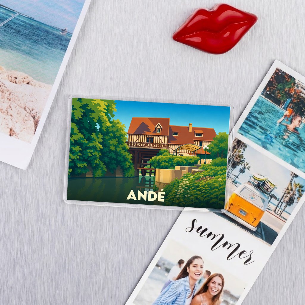 Magnet souvenir de la ville d'Andé avec une illustration stylisée de son moulin.