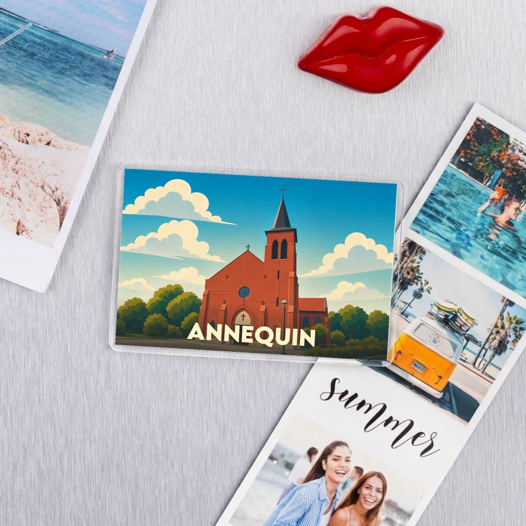 Magnet souvenir de la ville d'Annequin avec une illustration stylisée de son église sous un ciel nuageux.