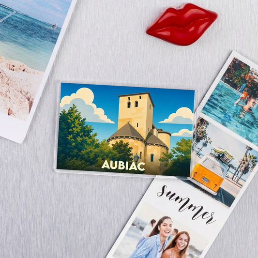 Magnet souvenir de la ville d'Aubiac avec une illustration stylisée d'un monument historique.