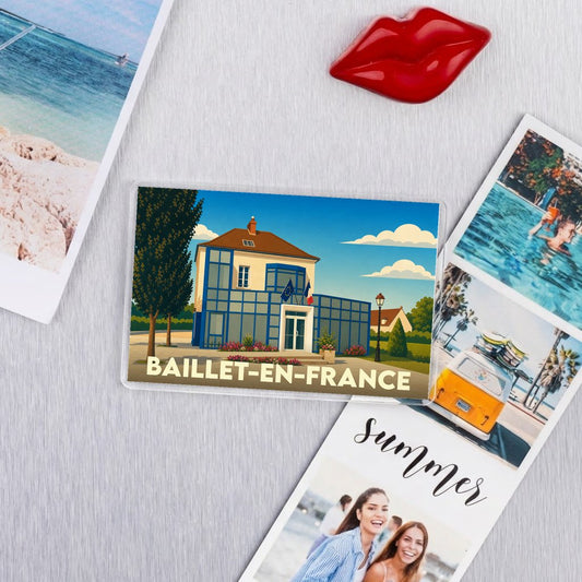Magnet souvenir de la ville de Baillet-en-France avec une illustration stylisée.