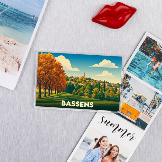 Magnet souvenir de la ville de Bassens avec une illustration paysagère stylisée.