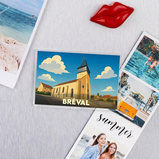 Magnet souvenir de la ville de Bréval avec une illustration stylisée de son église.