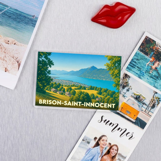 Magnet souvenir de la ville de Brison-Saint-Innocent avec une illustration paysagère stylisée.