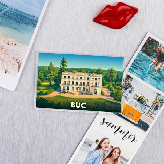 Magnet souvenir de la ville de Buc avec une illustration stylisée d'un château.