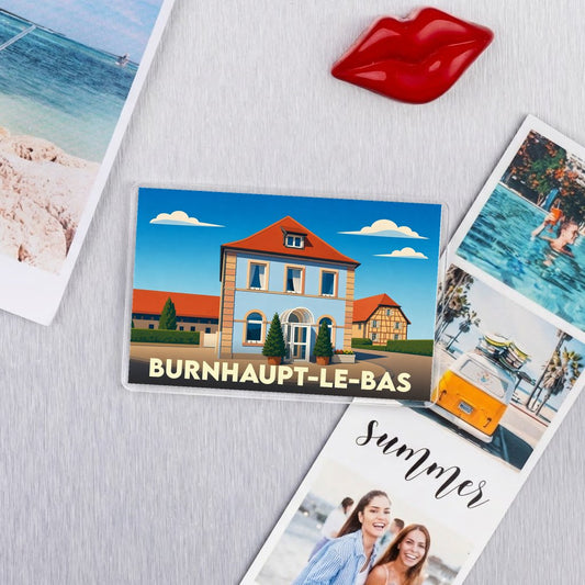 Magnet souvenir de la ville de Burnhaupt-le-Bas avec une illustration stylisée d'un bâtiment typique.