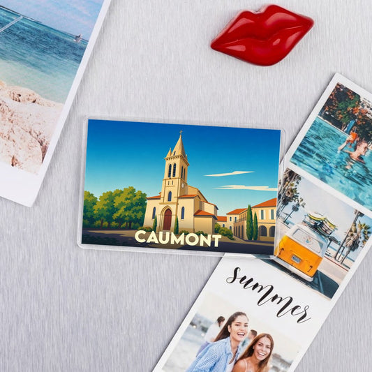 Magnet souvenir de la ville de Caumont avec une illustration stylisée de son église.