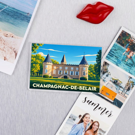 Magnet souvenir de la ville de Champagnac-de-Belair avec une illustration stylisée de son château.