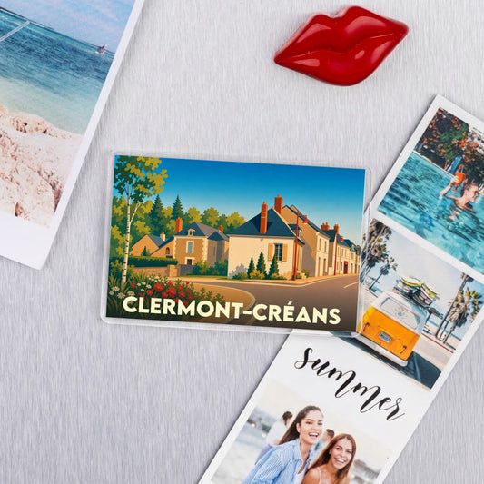 Magnet souvenir de la ville de Clermont-Créans avec une illustration stylisée d'habitations.