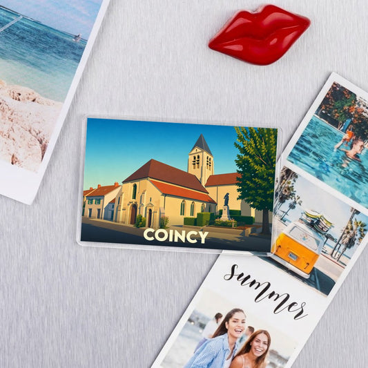 Magnet souvenir de la ville de Coincy avec une illustration stylisée de son église.