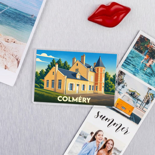 Magnet souvenir de la ville de Colméry avec une illustration stylisée d'un manoir.